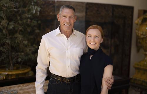 Gary Michelson, left, and Alya Michelson stand with arms around each other