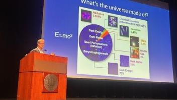 Professor Tommaso Treu presenting at podium