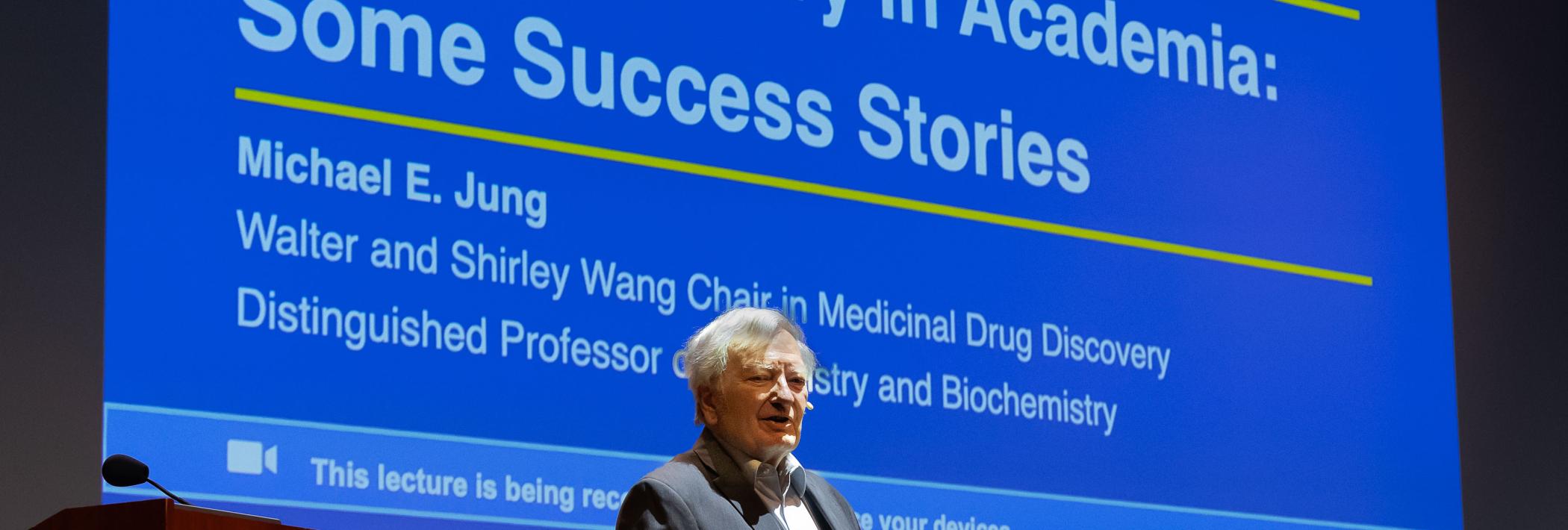 Michael E. Jung presenting his faculty research lecture. 